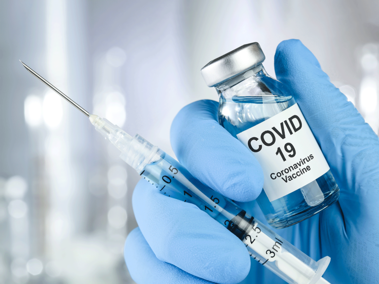 As the first COVID-19 vaccine gets approval, are we finally turning a corner?